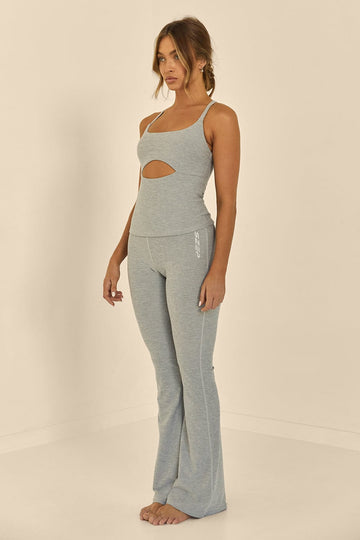 Grey Marle Szep full length flare pant with zero front seam. Small reflective Szep logo printed on right side leg near hip