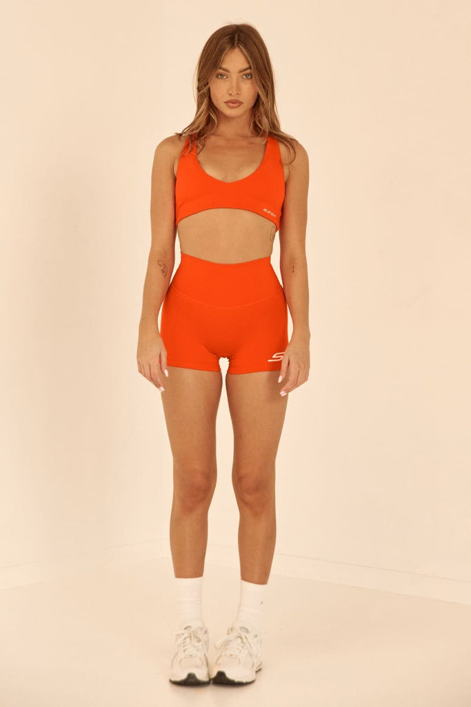Szep Papaya Orange 3inch Hot Pant with zero front seam and white Szep printed logo on bottom left leg